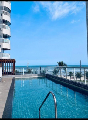 Vila Caiçara Apto à beira mar! Novinho